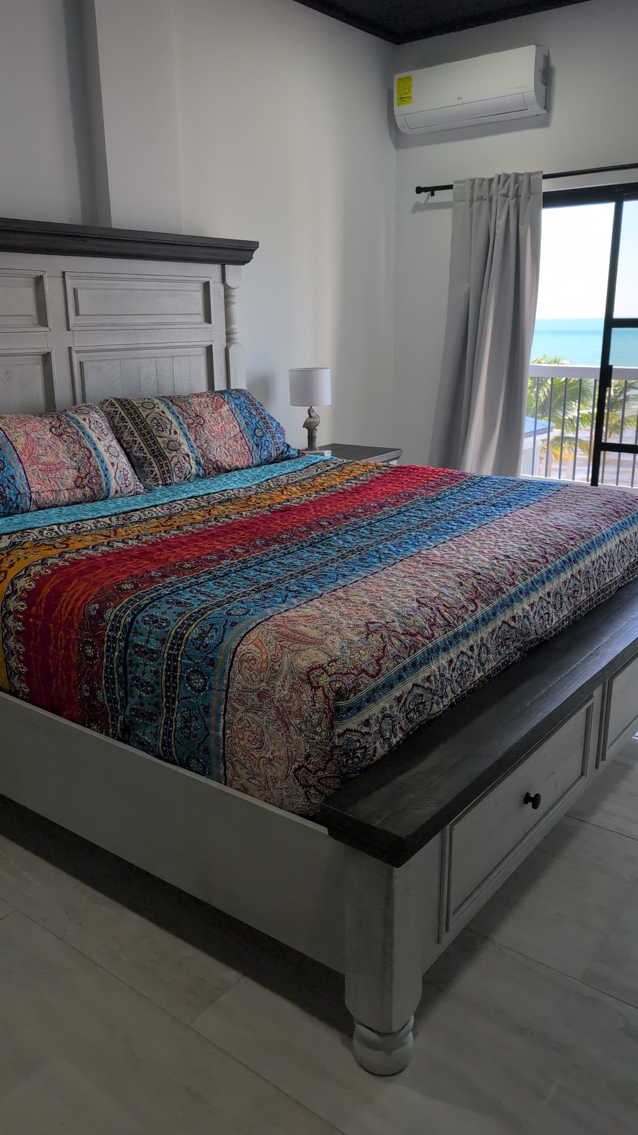 Master bedroom with view of the beach and ocean