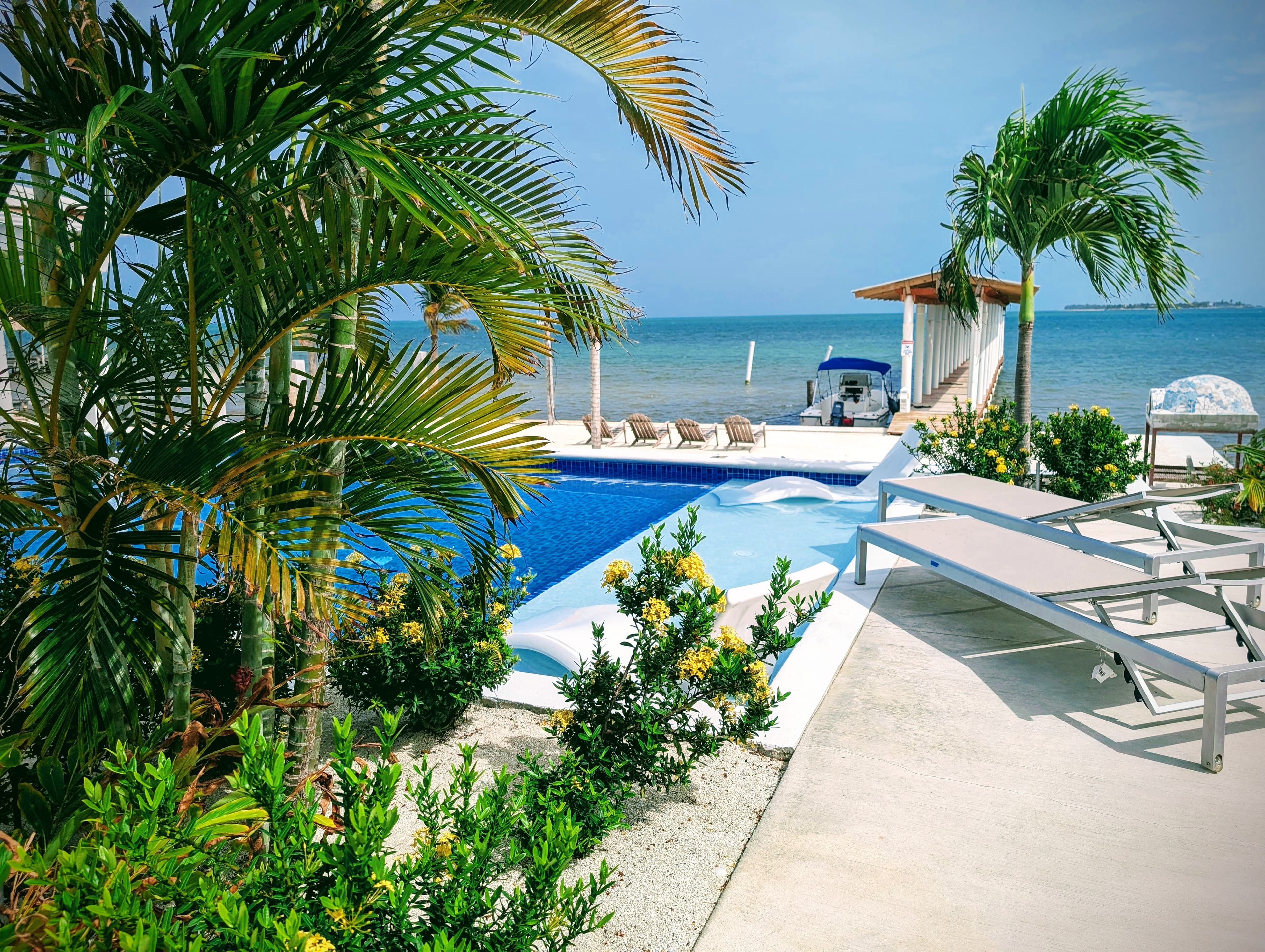 view of beach and pool from villa