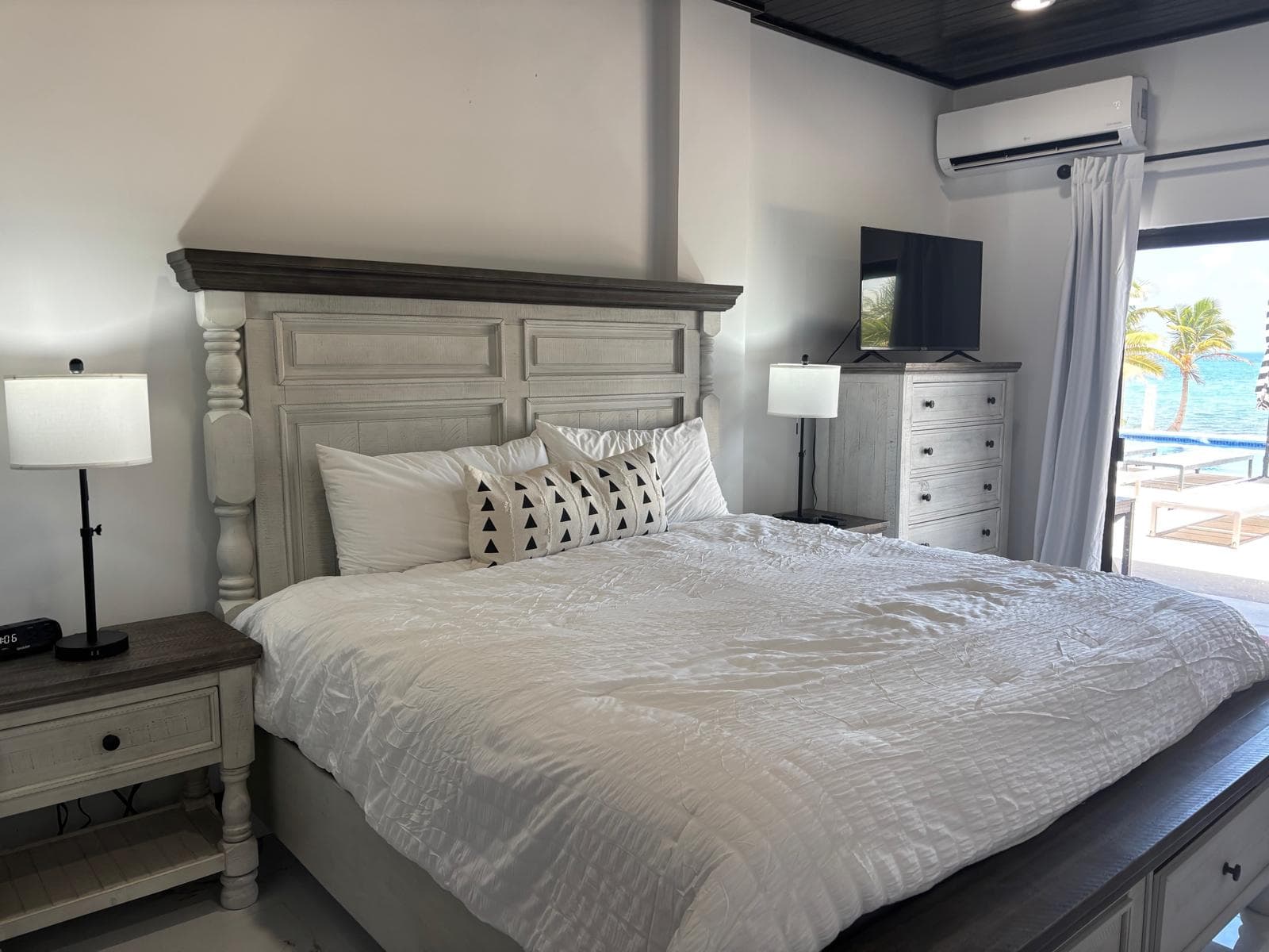 master king bedroom with ocean and pool view